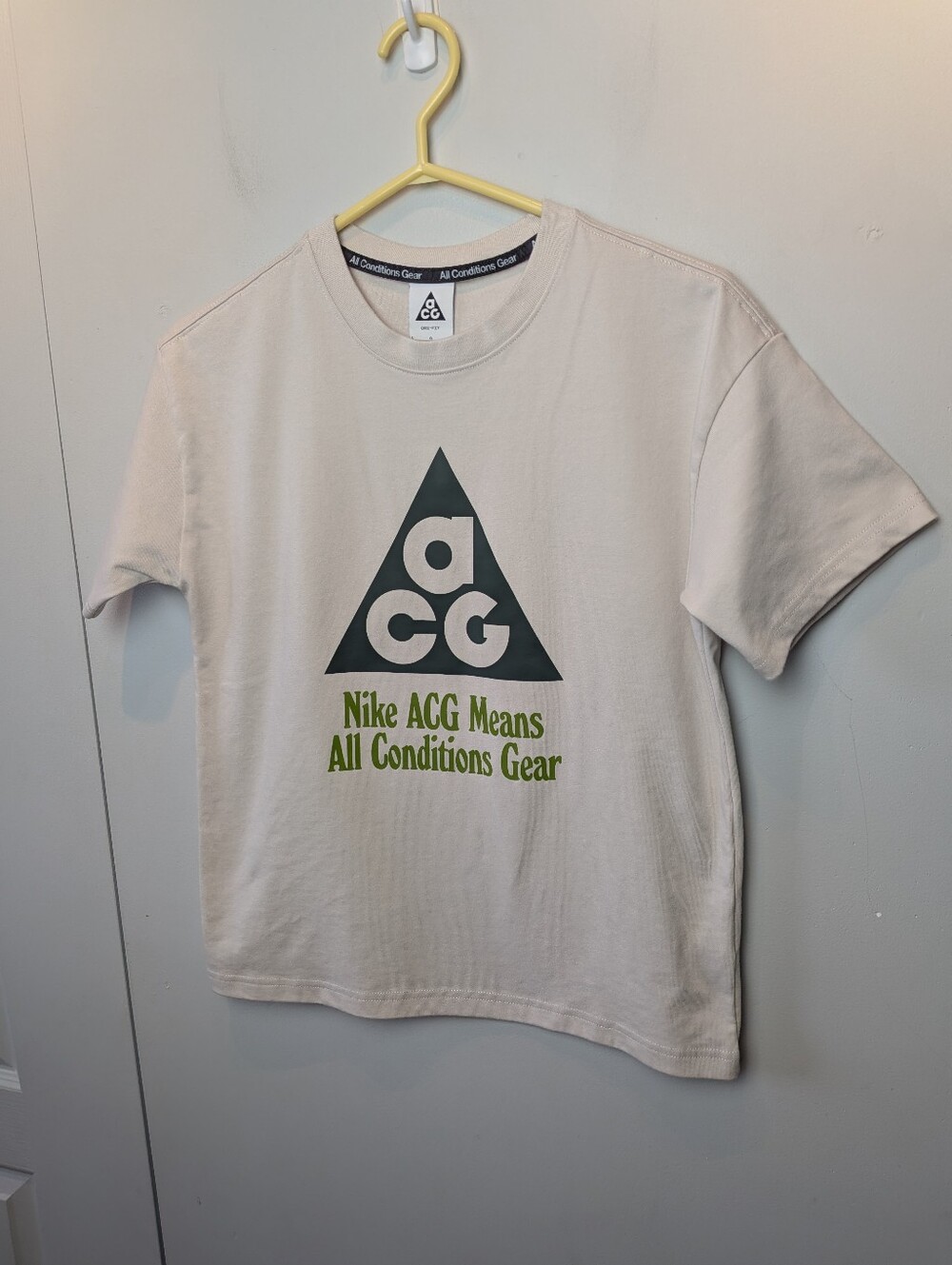Nike ACG Short Sleeve Tee in Beige with Black and Olive Logo